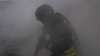 Ukraine -- Rescue workers fighting fire in Sumy region after a Russian strike, 15May2025 